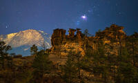 Pikes Peak and Pulpit Rock at night, with the Orion Nebula