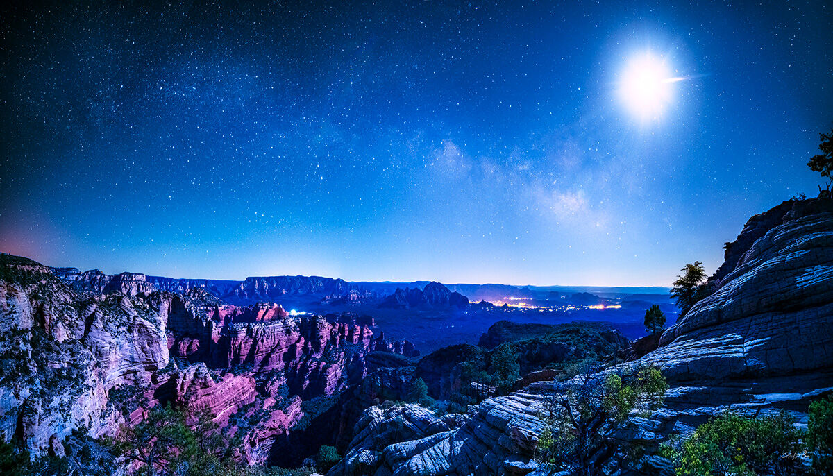 I hiked up Bear Mountain late one night to catch the Milky Way rising over Sedona, as the quarter moon lit up Fay Canyon below...