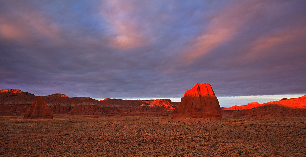 First light hits Temple of the Sun in Cathedral Valley.