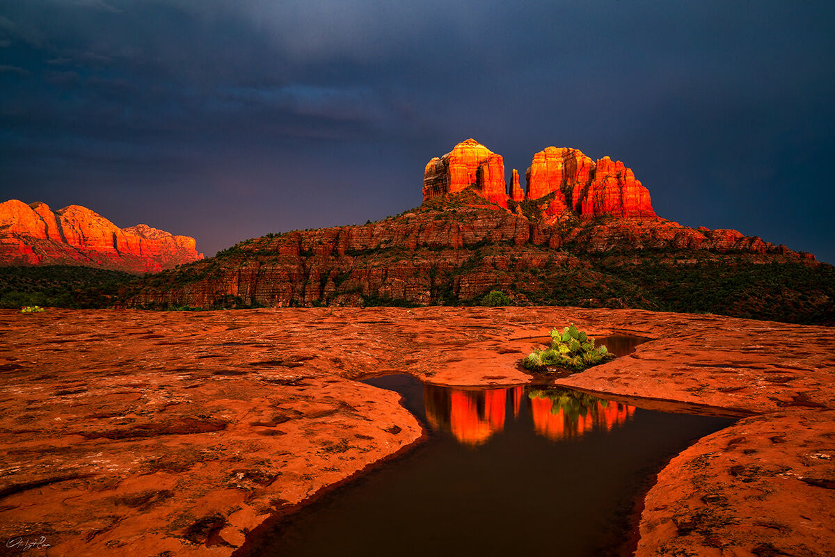Vivid monsoonal light before sunset dramatizes the red rocks overlooking Cathedral Rock in Sedona.